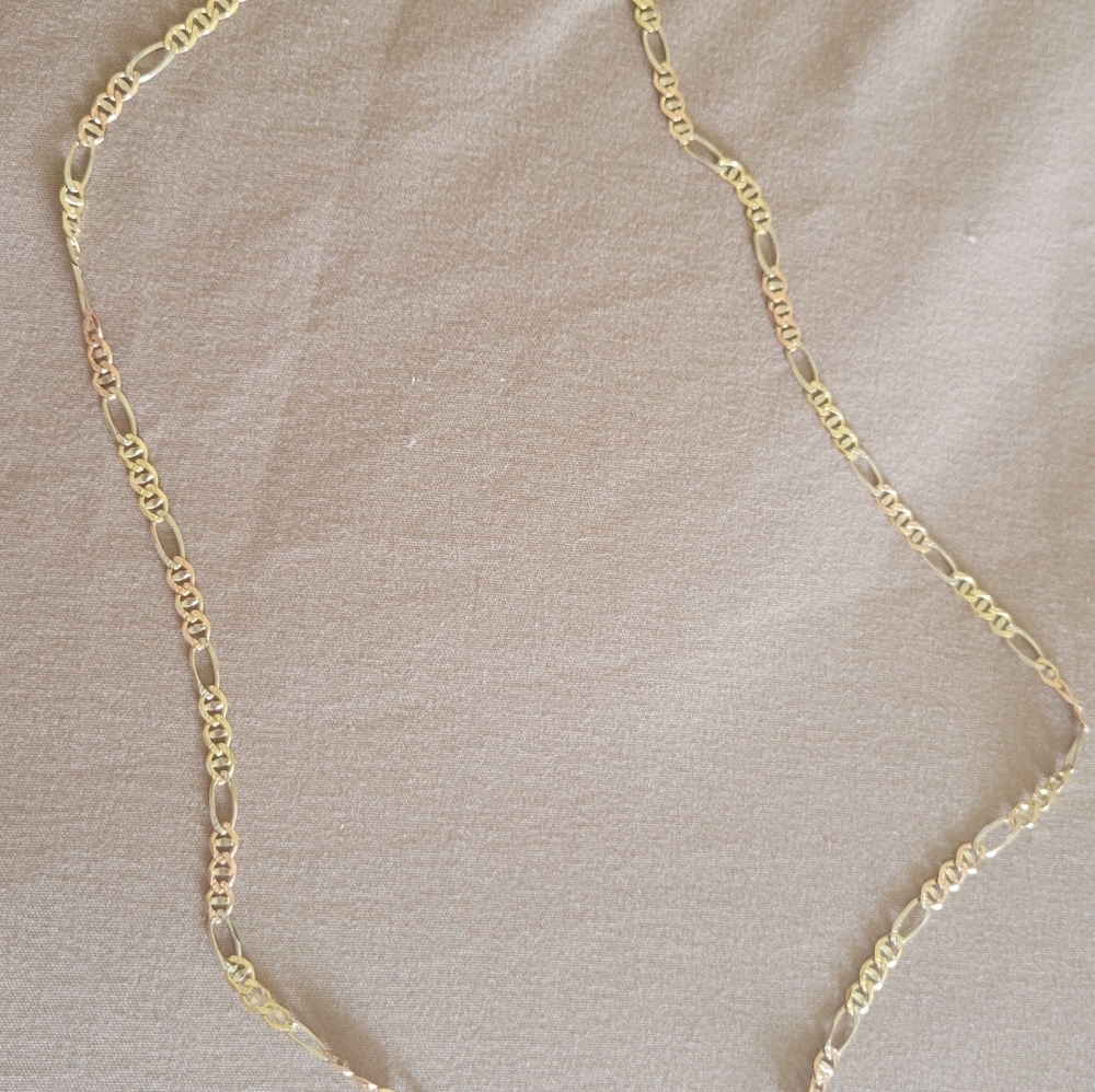 real gold chain and has rose gold is also medium size.
